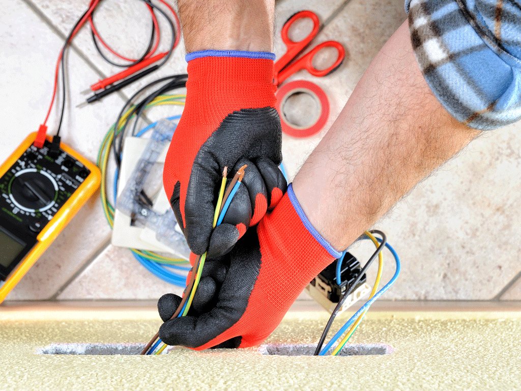 electrician with gloves on fixing wires at house electrical service canton tx kemp tx 